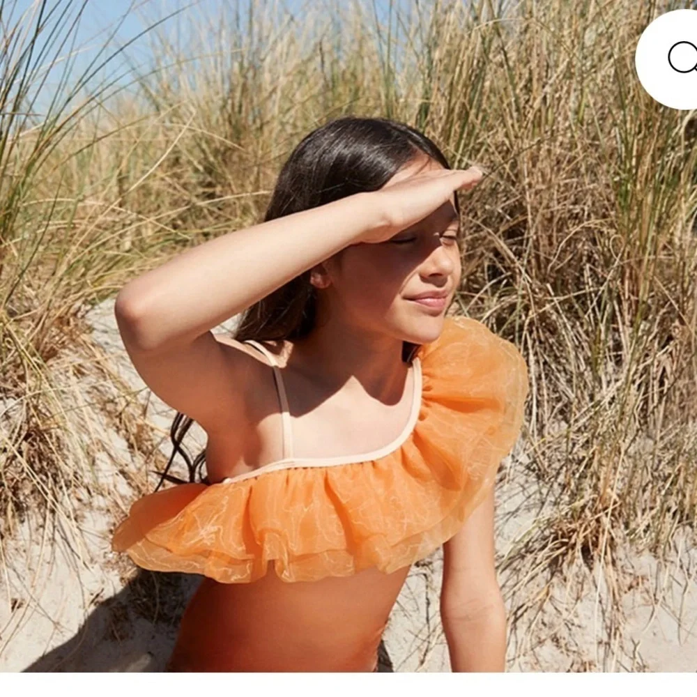 Orange and Brown Ruffled One-Shoulder Swimsuit by designer label, Molo